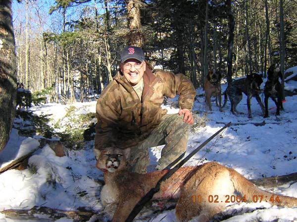 2004 Mountain Lion Joel Meena with his lion taken
                  with a long bow