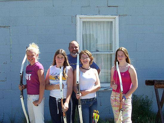 2005 YMCA Girls Camp Neal Perkins and the girls
                    take a break