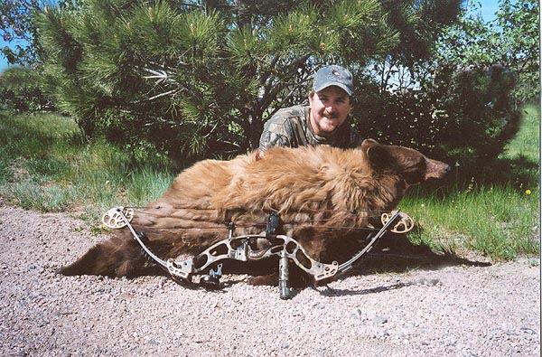 2005 Bear Hunters Justin Beach with his first
                    bear