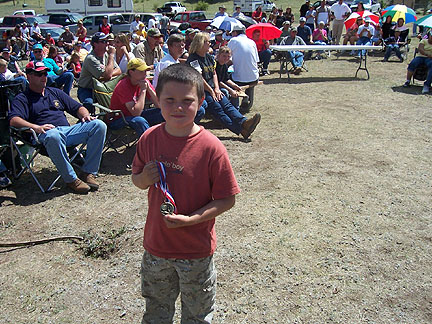 2005 Bowhunters Weekend Tanner Carroll with his
                    award
