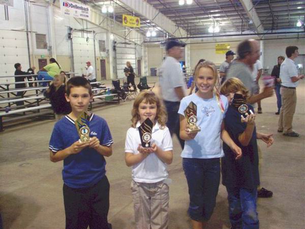 2005 JOAD Colton, Calista, Brittany, and Adam
                    showing their trophies